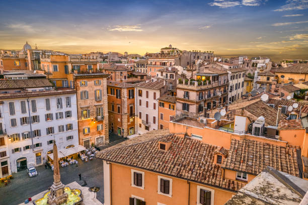 an idyllic sunset over the rooftops of the heart of rome seen from a terrace in the pantheon district - rome ancient rome skyline ancient imagens e fotografias de stock