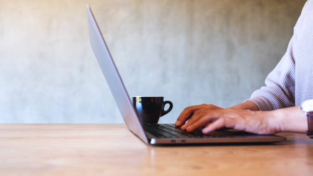 istock a woman working and typing on laptop computer keyboard on the table 1291730418