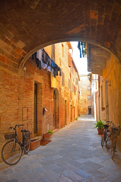 Alley in Buonconvento A residential alley in the historic medieval village of Buonconvento, Siena Province, Tuscany, Italy crete senesi photos stock pictures, royalty-free photos & images