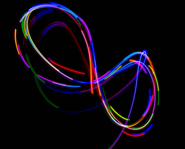 istock Abstract multicolored lines drawn by light on a black background 1291732851