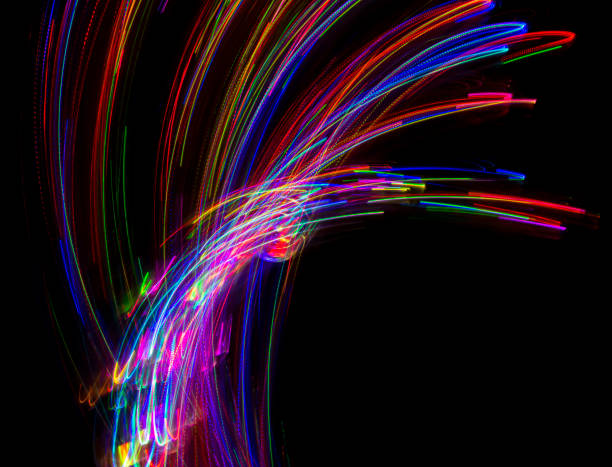 istock Abstract multicolored lines drawn by light on a black background 1291732879