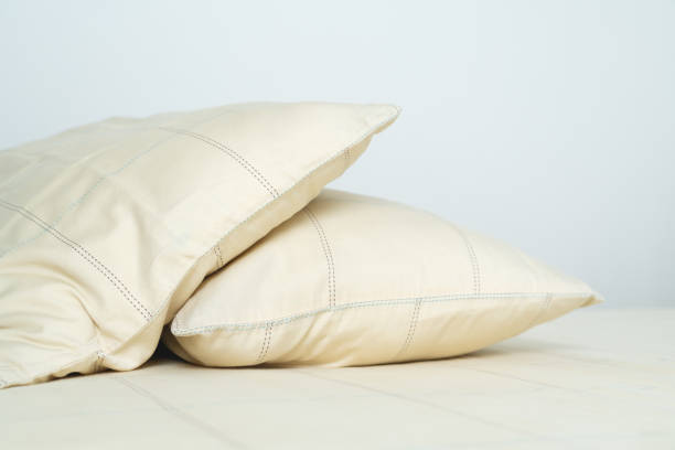 istock couple comfortable soft yellow pillows on bed 1291732963