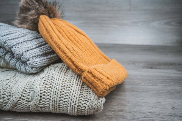 istock Yellow golden wool sweaters and beanies 1291734857