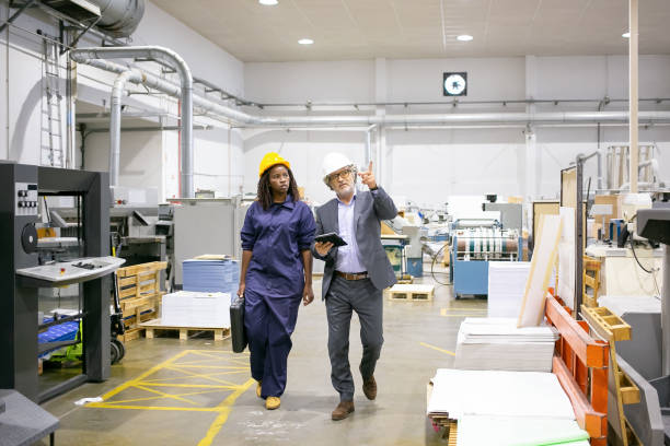 istock Mature male engineer and young black female technician 1291736464