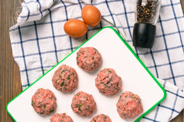 istock Cooking meat cutlets with herbs 1291738786