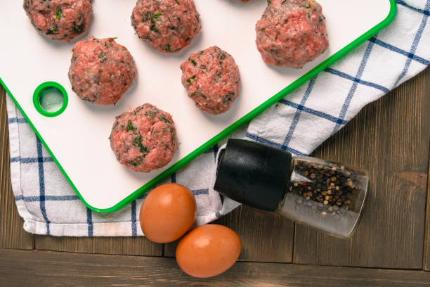 istock Cooking meat cutlets with herbs 1291738838