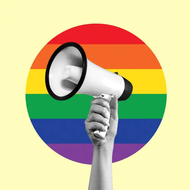 Photo of Art design. Female hand with megaphone isolated on LGBT flag background.