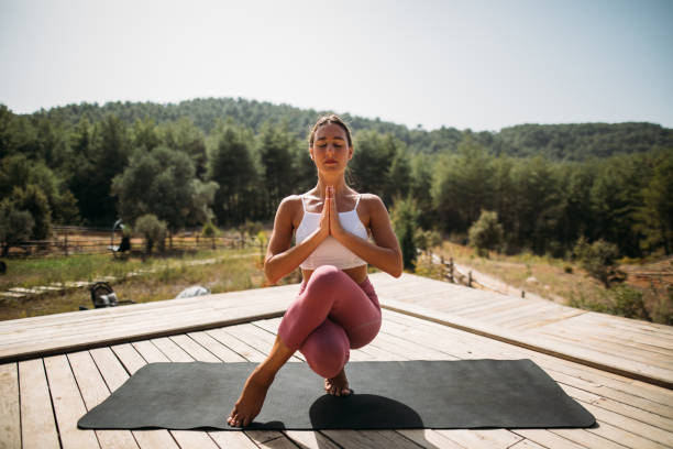 Young sporty woman practicing yoga