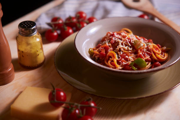 istock Spaghetti pomodoro with tomato sauce and parmesan cheese in a bowl 1291741122