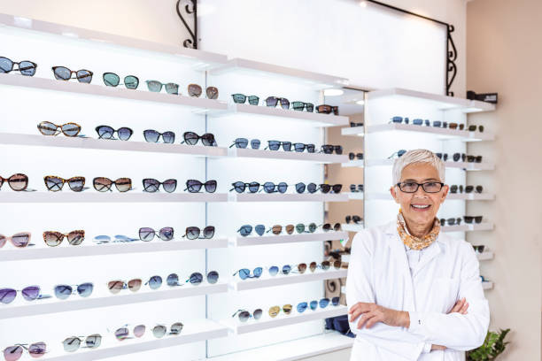 istock Posing optometrist woman in eyeglasses store smiling looking at camera 1291742230