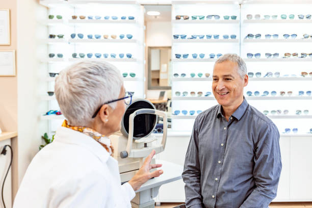 istock Mature Patient consulting With Optician In Office 1291742478