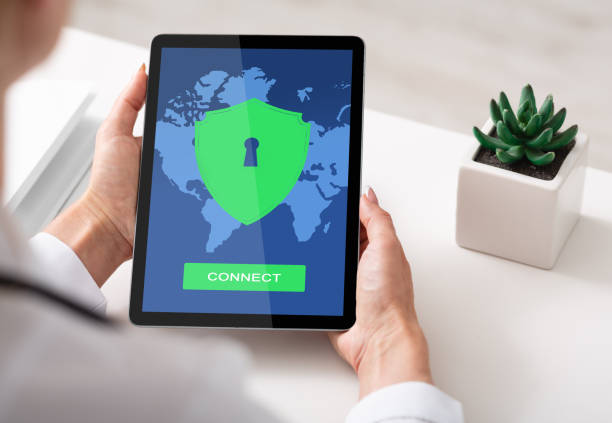 istock Woman using vpn app on digital tablet for syber security and privacy 1291747748