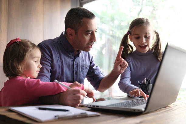 istock Father Trying To Work At Home And Children Distracting Him From Work, Concept For Difficulties Of Remote Working In Pandemic Period 1291747916