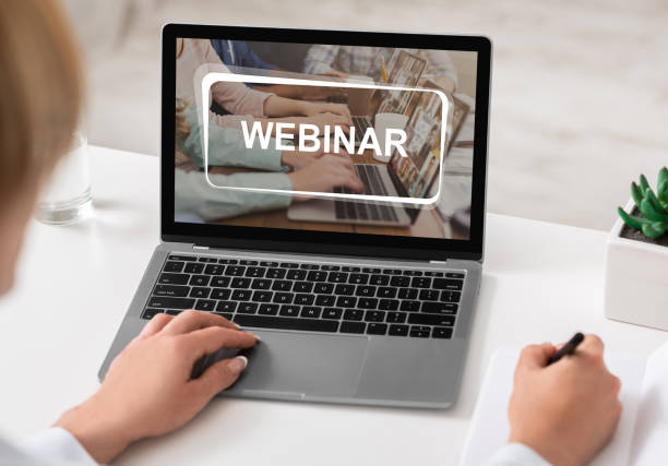 istock Unrecognizable woman studying online on laptop, attending webinar 1291747919