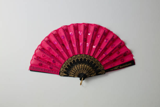 istock red spanish fan with letters Barcelona on white background 1291748110