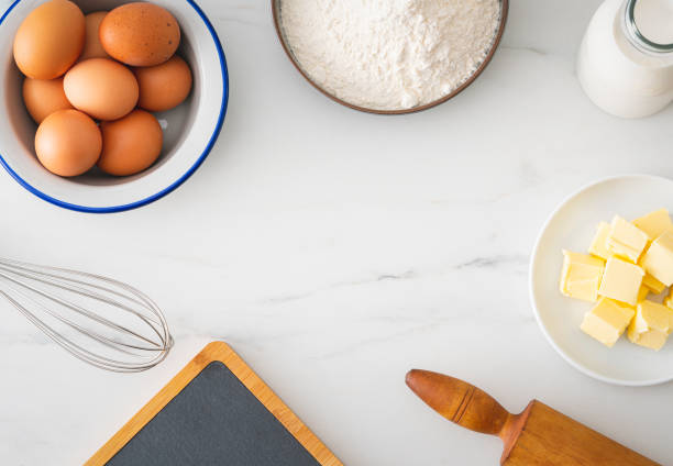 istock Baking homemade bread on white kitchen worktop with ingredients for cooking 1291748275
