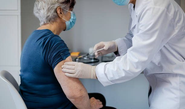 istock Senior woman being vaccinated against coronavirus 1291748336