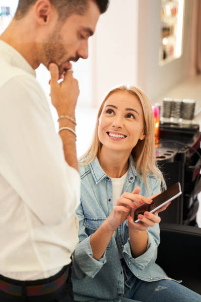 istock Hairdresser pondering while serving his client 1291751142