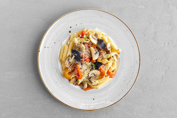 istock Pasta with mushrooms and cream sauce served on plate 1291752454