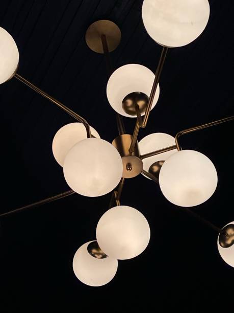istock Geometric chandelier on the ceiling in dark 1291754059