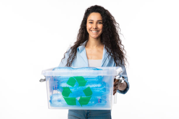 istock Woman Holding Box With Used Plastic Litter Posing In Studio 1291754091