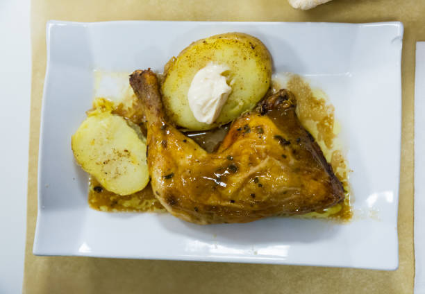 istock Baked chicken legs with potatoes 1291755194