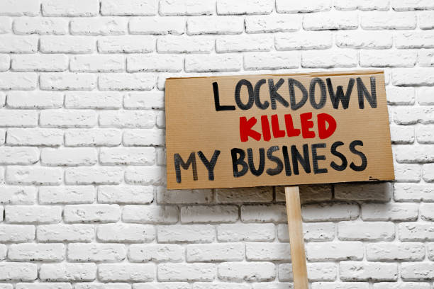 istock Protestive placard against coronavirus lockdowns against grey background 1291756496