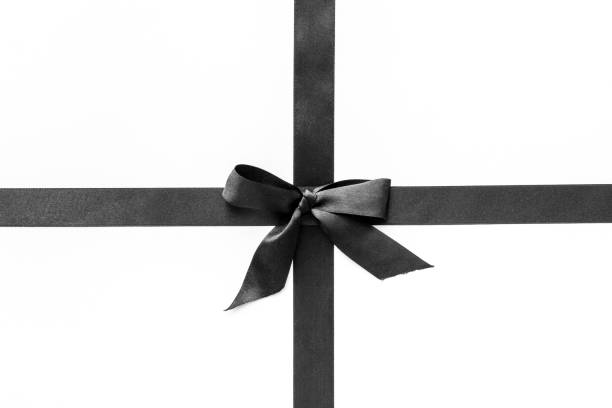 istock Black ribbon with bow isolated on white. Top view, copy space 1291756658
