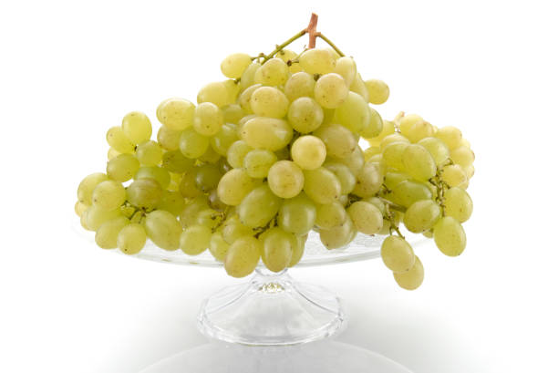 istock White table grapes raised glass tray isolated on white background 1291759307