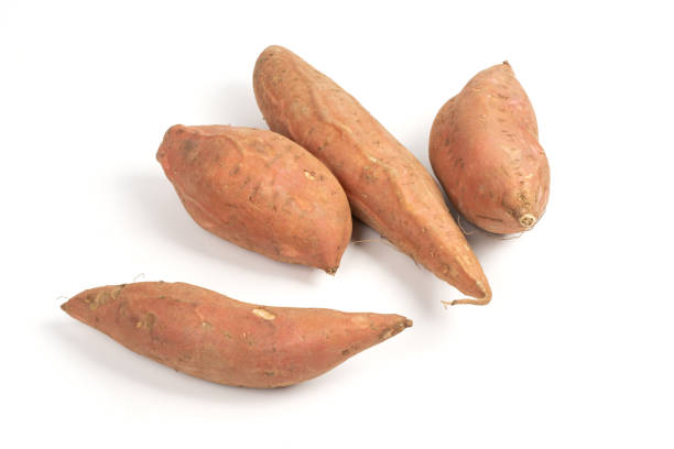 istock Raw Sweet Potato on White Background 1291759894