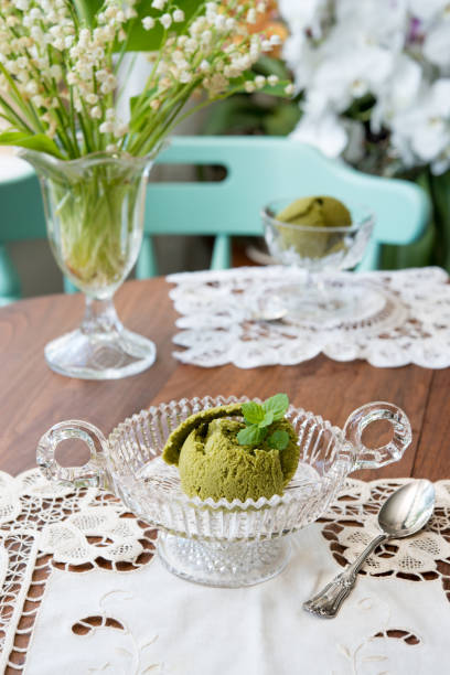 Matcha ice cream in footed glass bowl