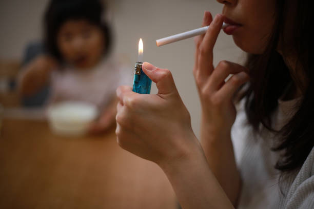 istock Mother smoking near children 1291760063