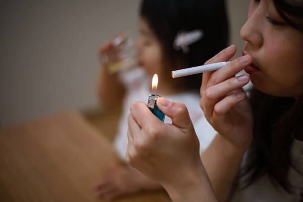 istock Mother smoking near children 1291760091