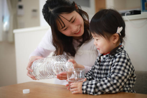 istock Parents and children drinking water 1291761319