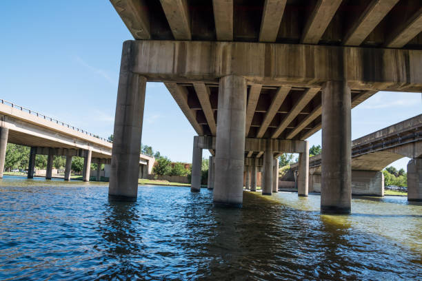 istock a concrete bridge in the lake water 1291764062