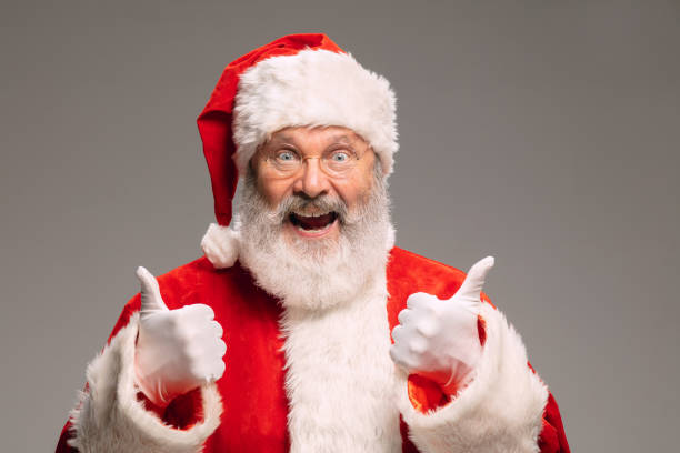 istock Senior man like Santa Claus isolated on grey studio background 1291764357