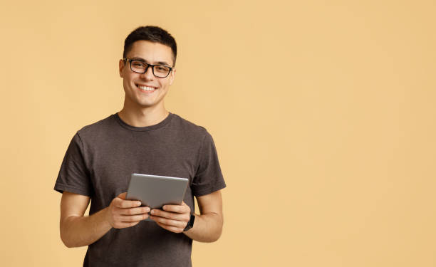 istock Handsome student blogger works at home on self-isolation 1291765561