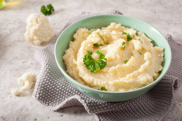 mashed cauliflower with butter. ketogenic paleo diet side dish mashed cauliflower with butter. ketogenic paleo diet side dish mashed potatoes stock pictures, royalty-free photos & images