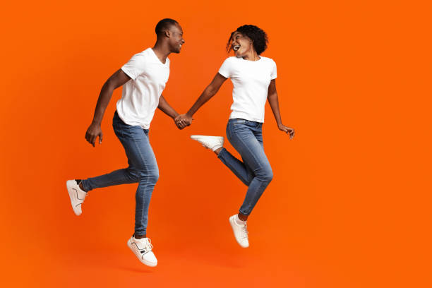 istock Loving african american couple running towards copy space 1291772023