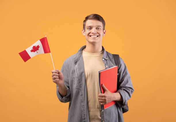istock Canada day, patriotism and knowledge sharing. Millennial smiling european guy 1291772645
