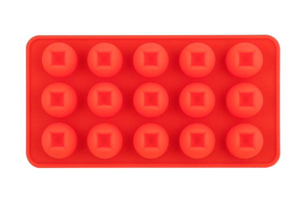 istock Red silicone form isolated on white background. Candy cup, silicone mold, bakeware. Top view, flat lay 1291774350