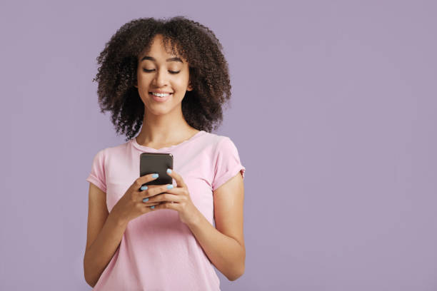 istock Modern devices and online communication. Happy lady looking in smartphone 1291775921