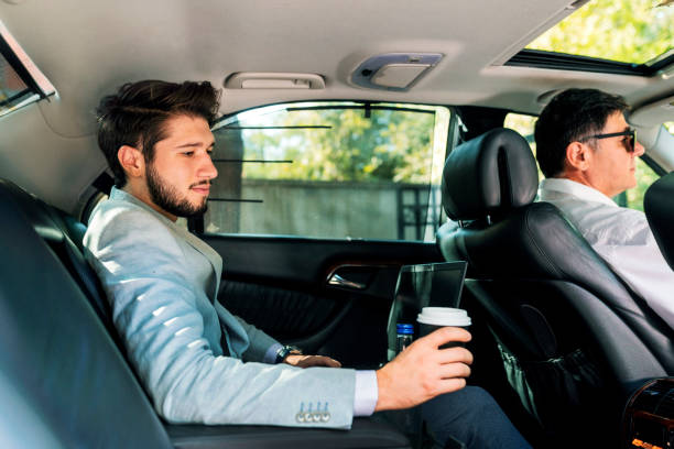 istock Young businessman at car 1291777444
