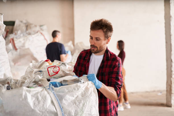 istock Man working at the waste recycling plant 1291778022