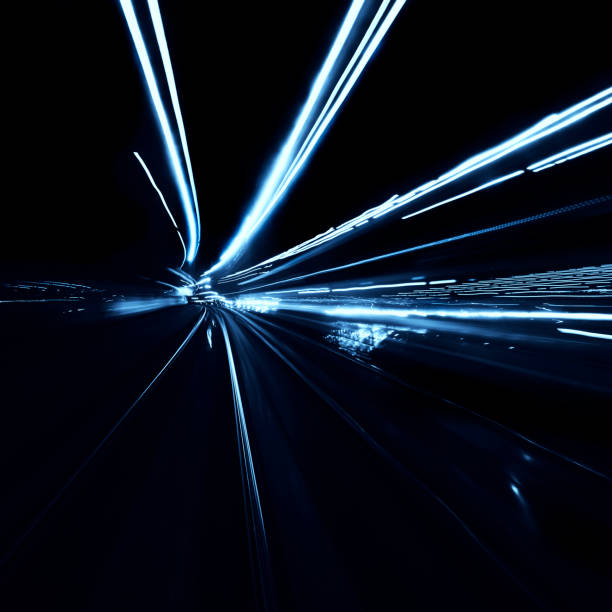 istock Abstract long exposure blurred city lights 1291779304