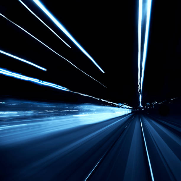 istock Abstract long exposure blurred city lights 1291779306