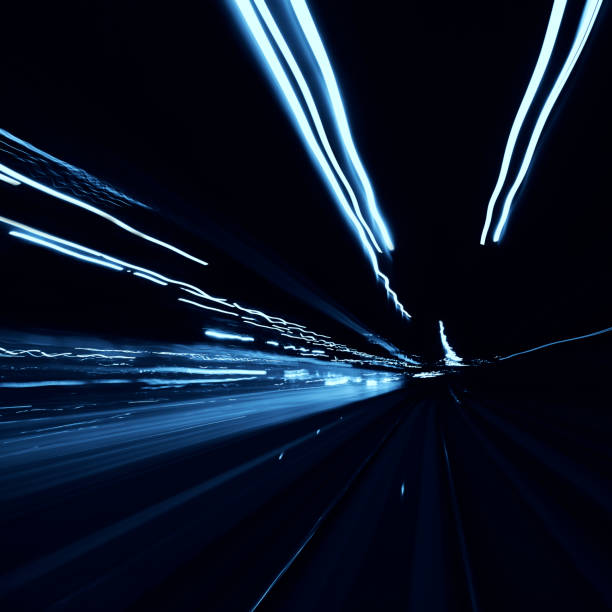 istock Abstract long exposure blurred city lights 1291779341