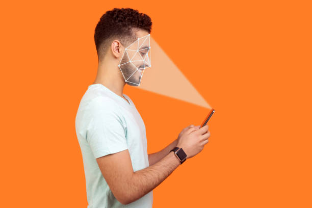Mobile biometric identification and verification or detection concept. face ID scaning or unlocking technology. happy man using facial recognition on smartphone.
