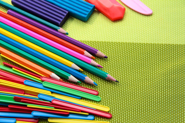 istock Colored pencils, plasticine and sticks for counting on a bright background. 1291781868