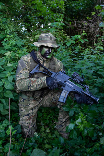 istock Recon unit soldier in his forest camoflauge 1291781950